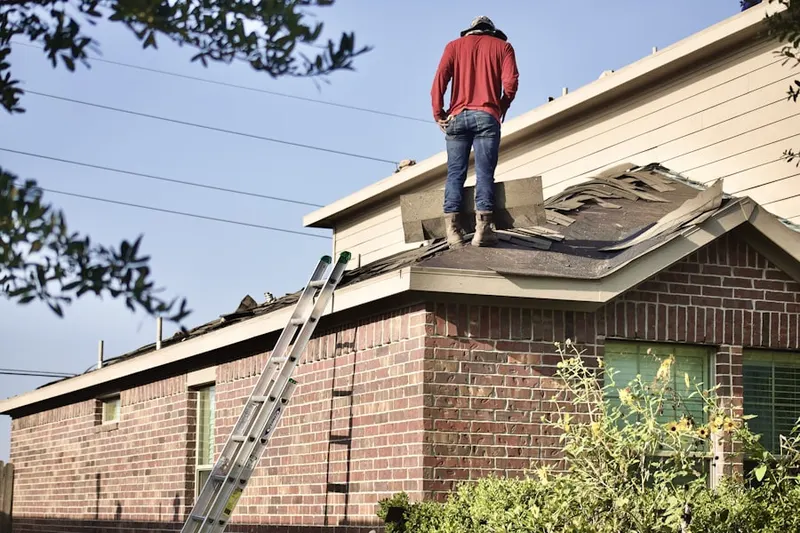 Professional roofer working on a residential roof in Vista Income Estates